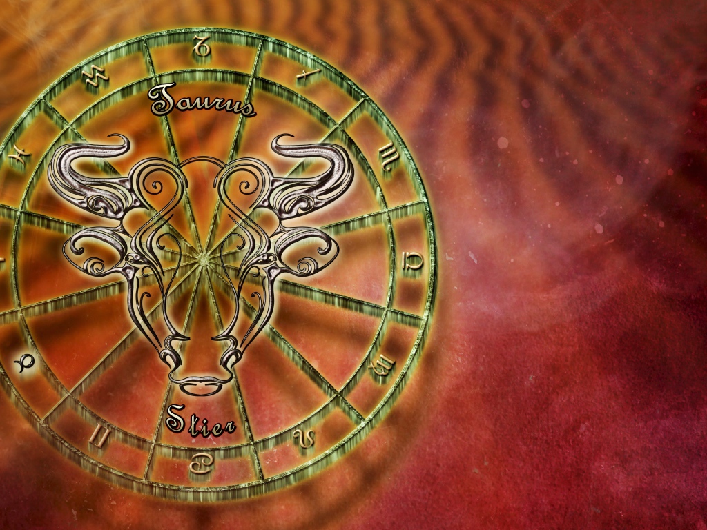 Зодиакальный знак телец на оранжевом фоне