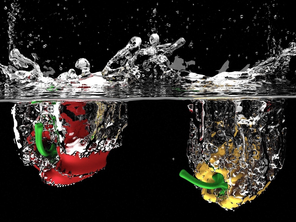 Красный и желтый перец в воде на черном фоне