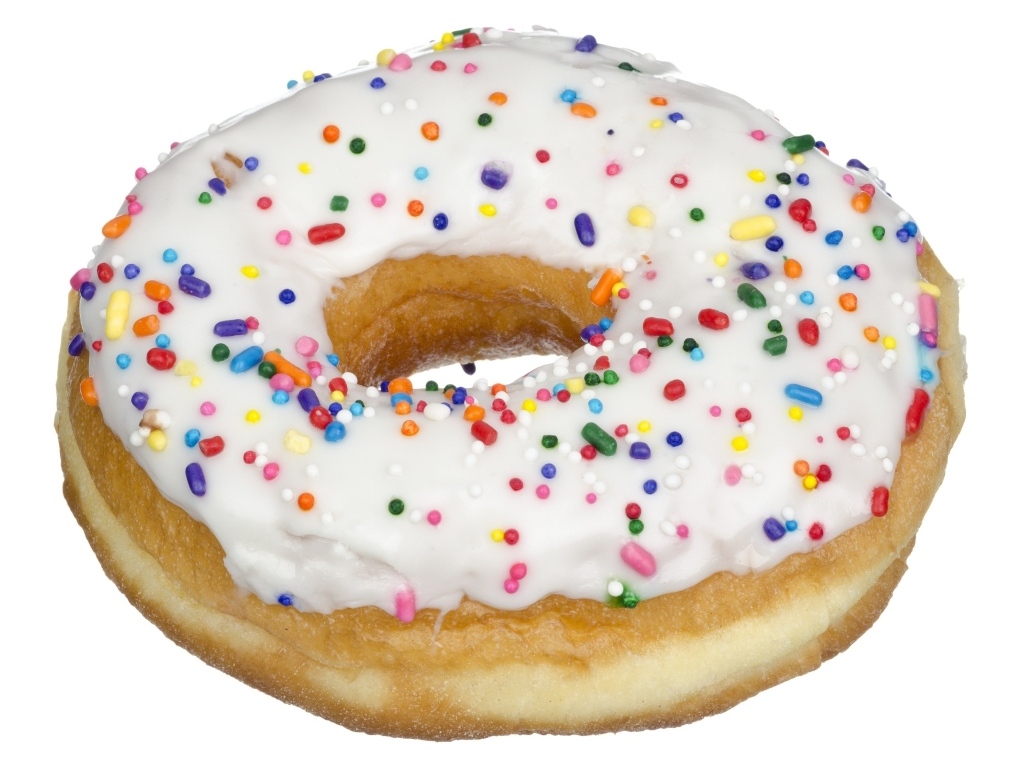 Большой круглый пончик в глазури на белом фоне