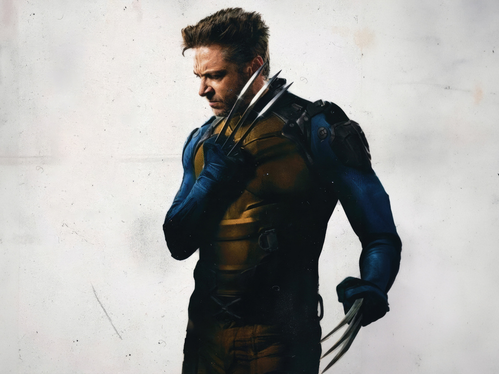 Супергерой Росомаха на сером фоне