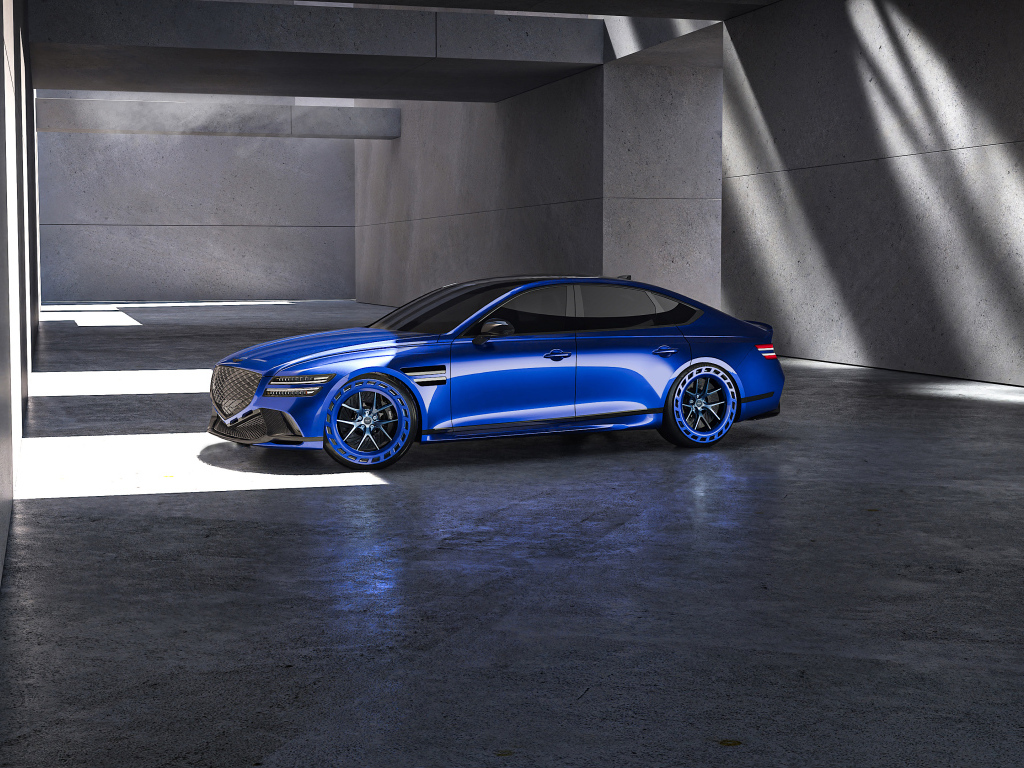 Вид сбоку на синий автомобиль  Genesis G80 EV Magma Concept 2024 года