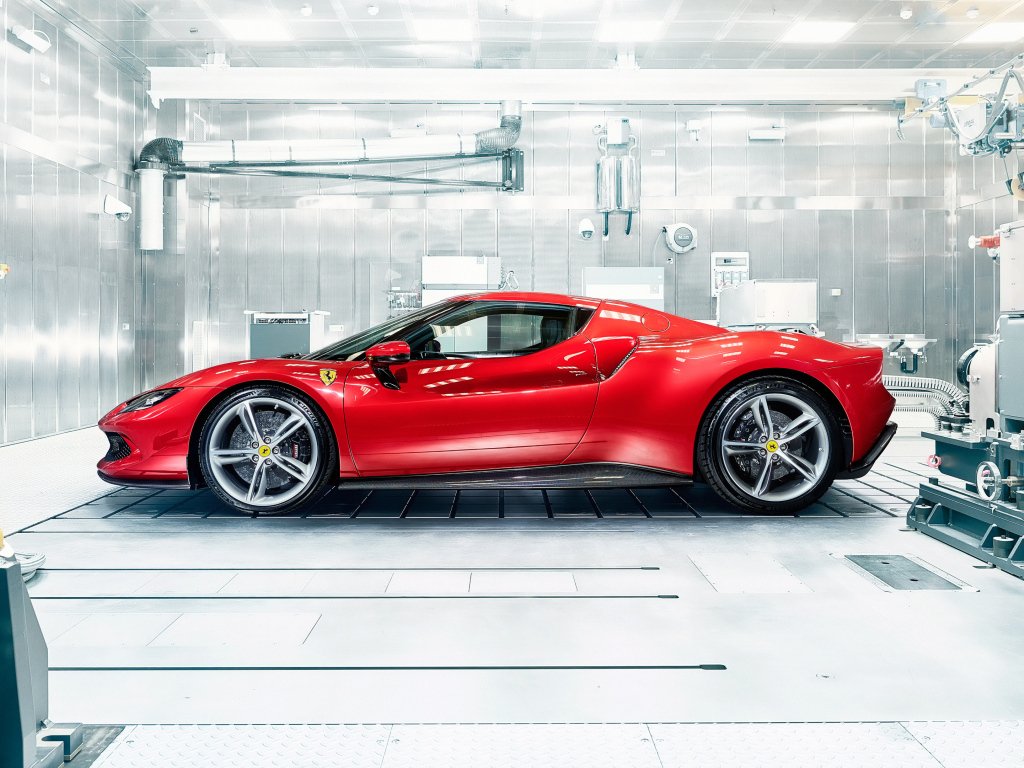 Красный автомобиль Ferrari 296 GTB в гараже