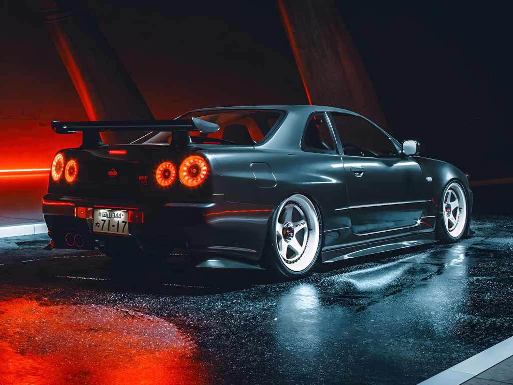 Черный автомобиль Nissan Skyline GTR R35 вид сзади