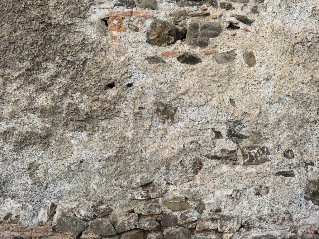 Старая текстурированная стена из цемента и кирпича для фона