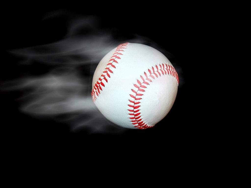 Baseball ball flies on a black background