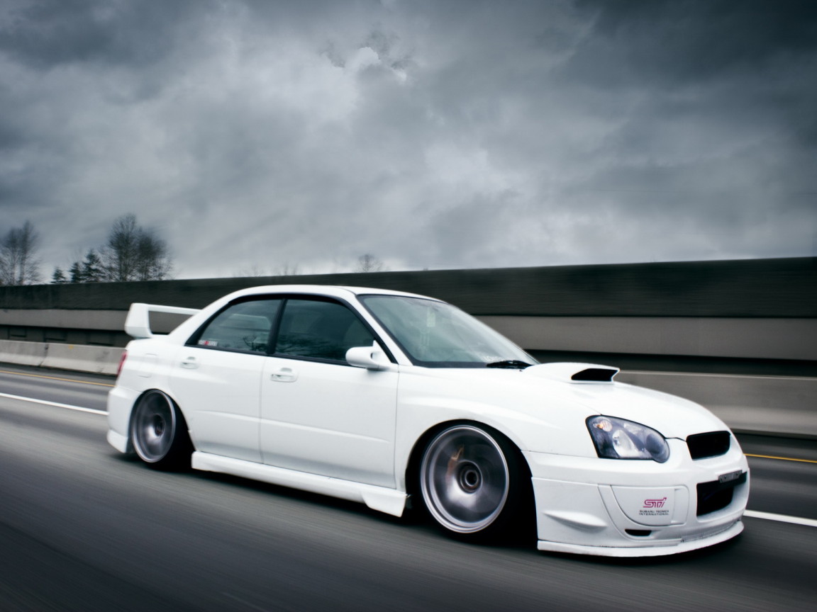 white Subaru Impreza STI