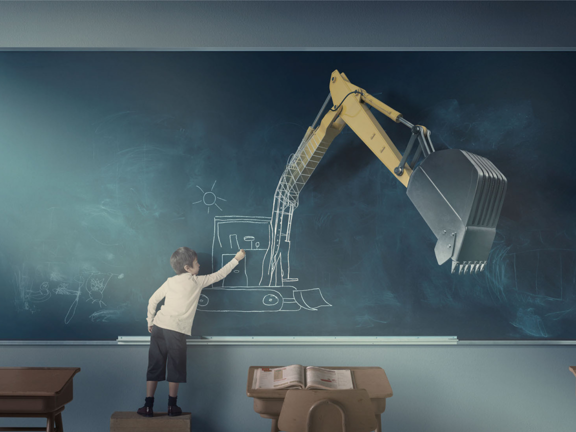 Мальчик рисует экскаватор