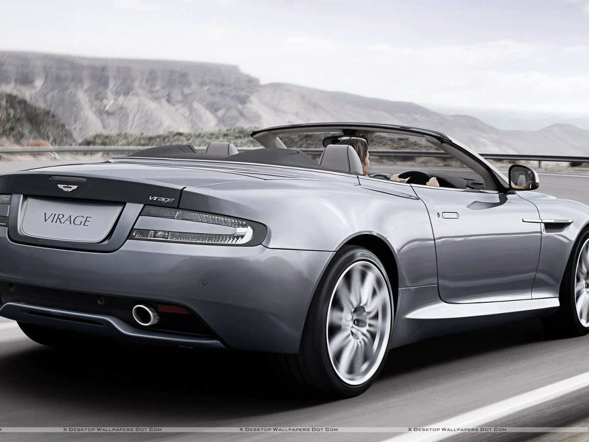 Автомобиль Aston Martin virage на дороге
