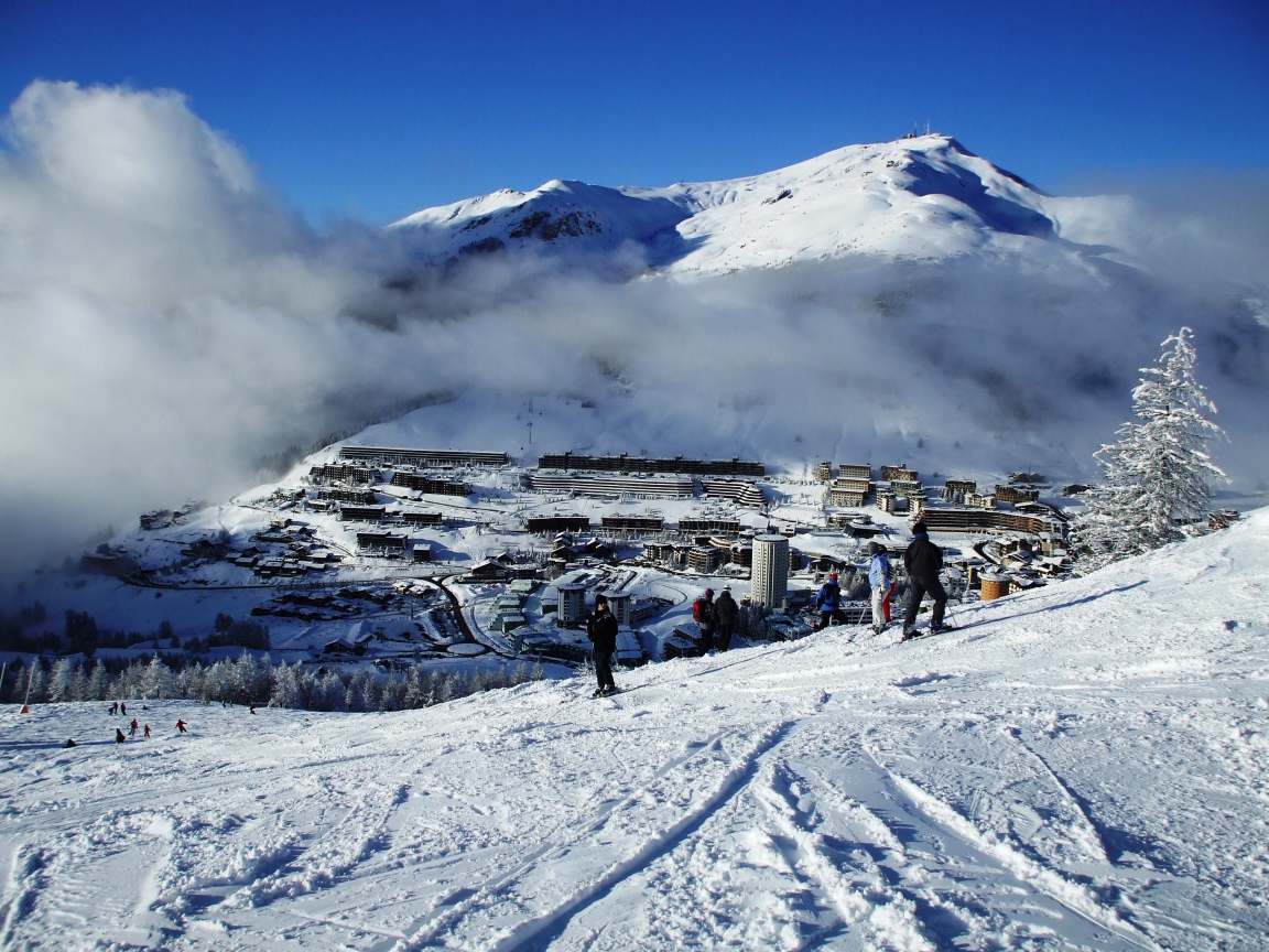 Fog over the city at the ski resort Sestriere, Italy