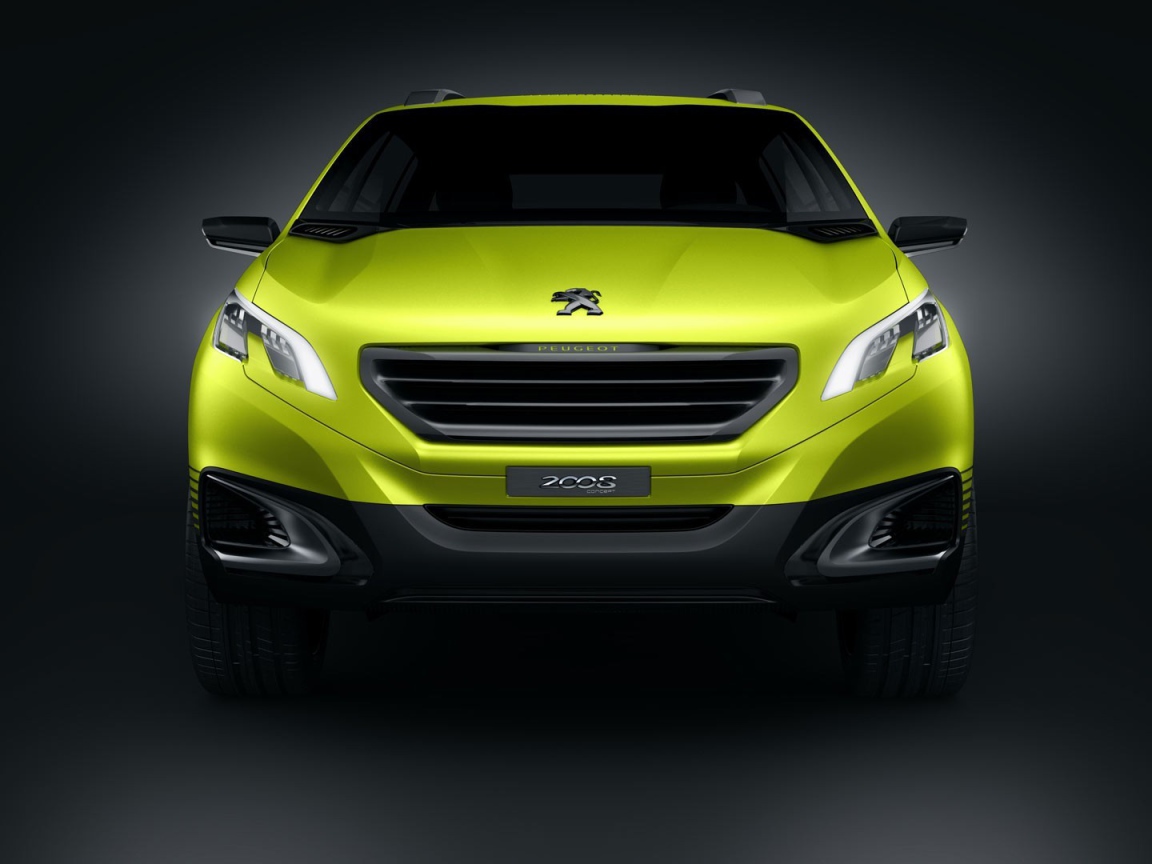 Желтый Peugeot 2008 на сером фоне