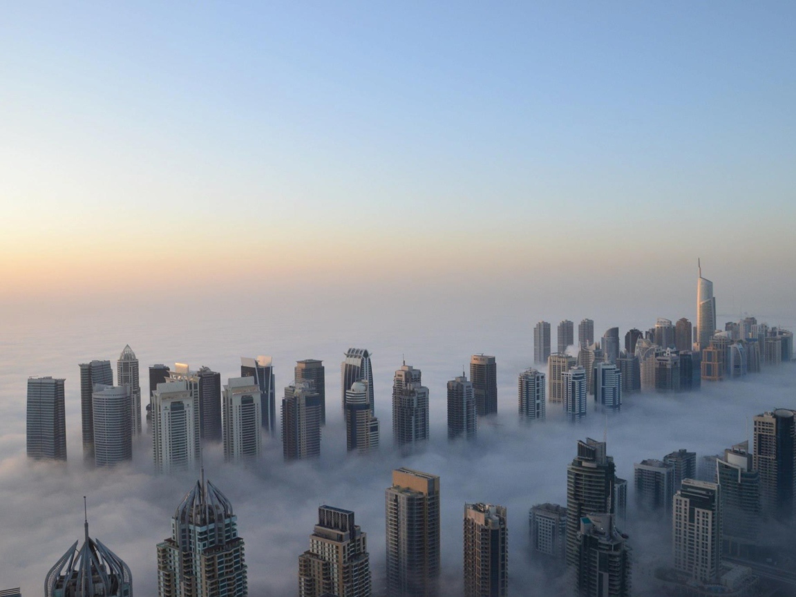 	   The city of Dubai in the clouds