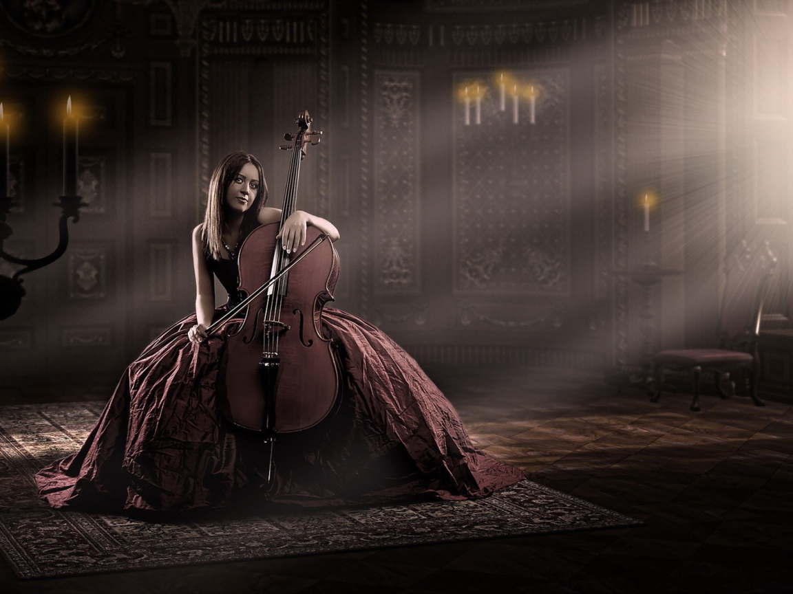 Девушка в роскошном платье играет на виолончели