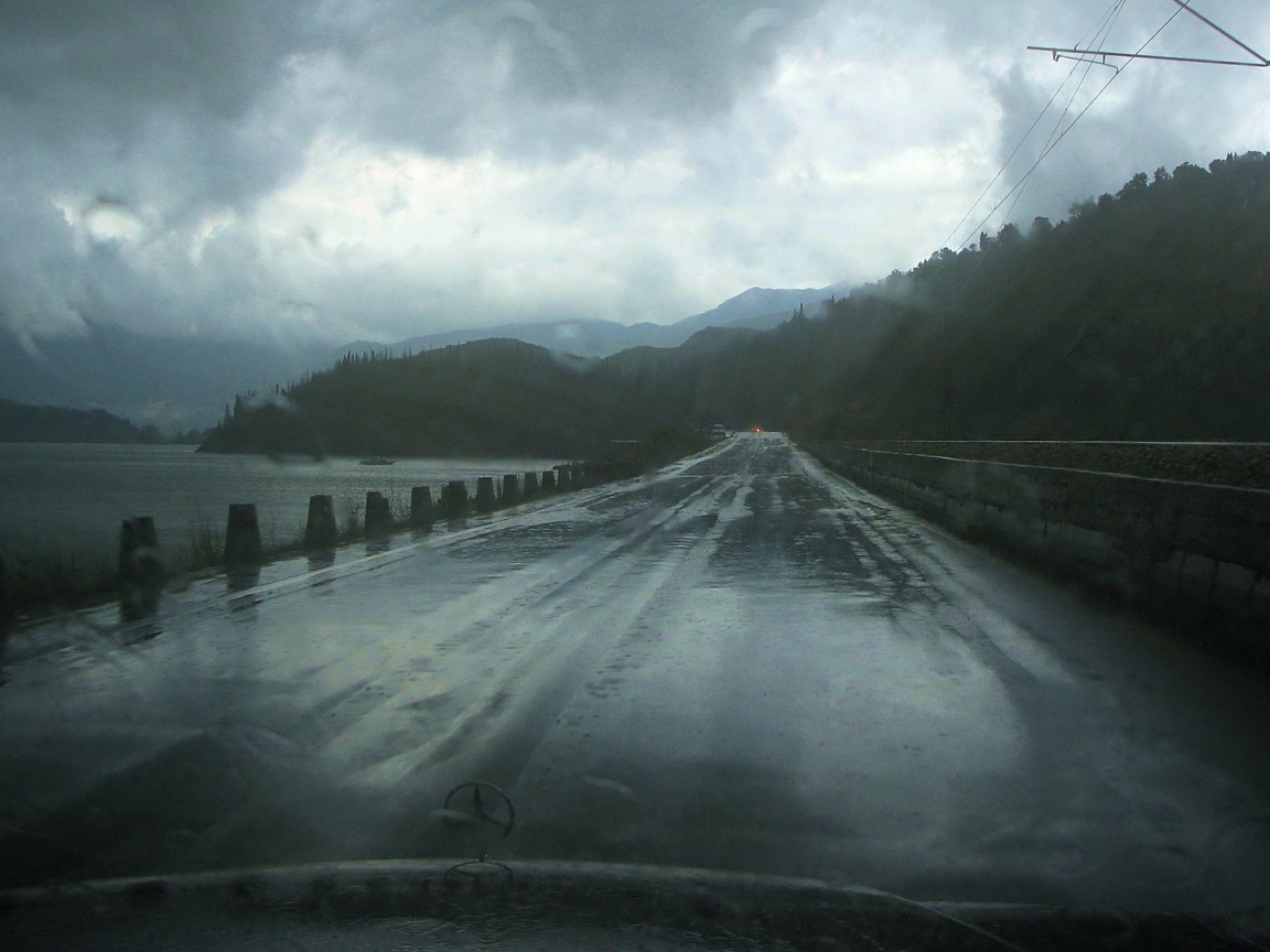 The road by the sea in the rain