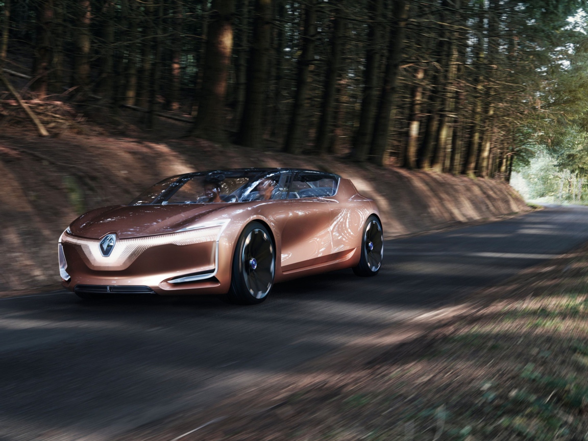 Brown electric car Renault Symbioz on the road in the woods