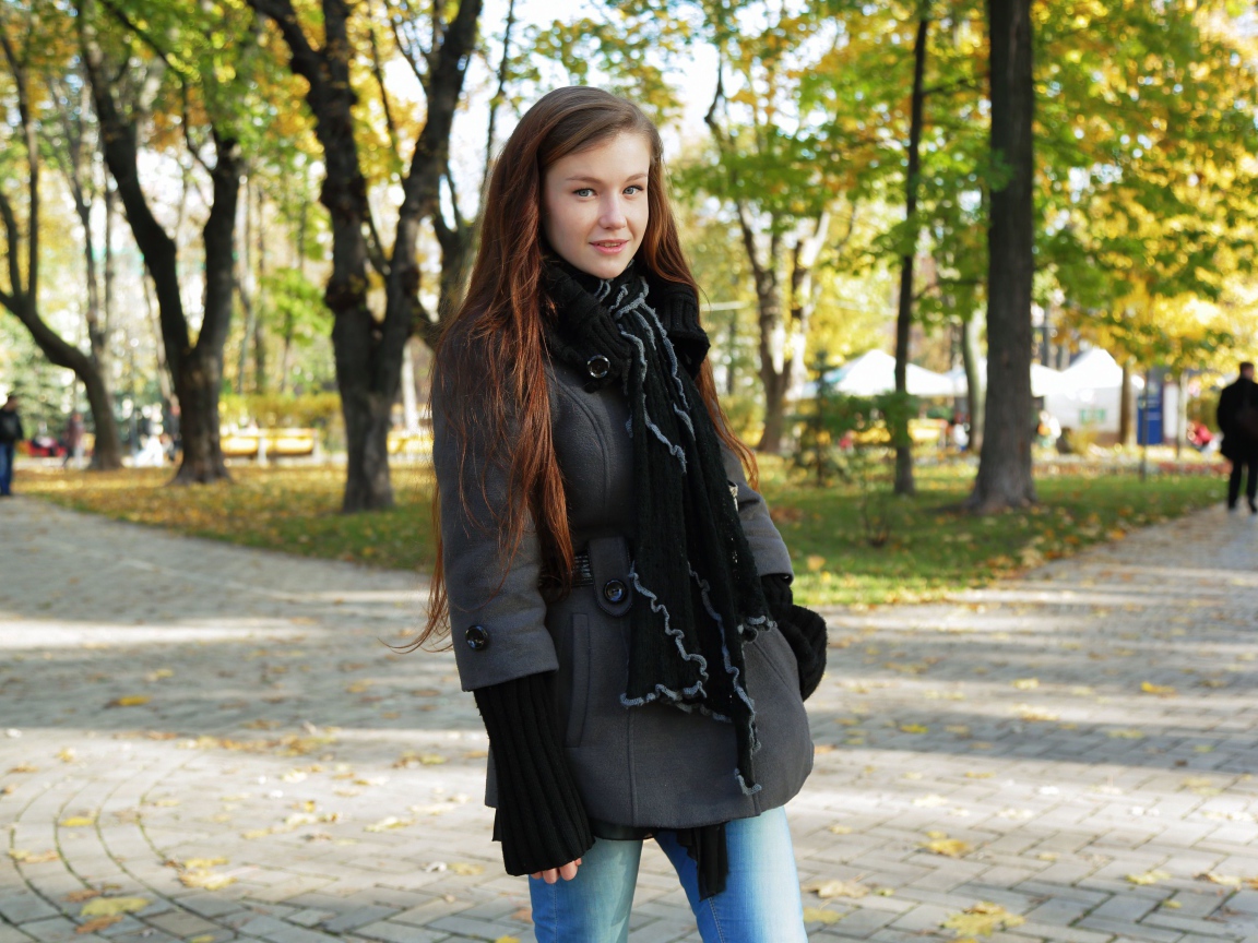 Delicate young girl in Emily Bloom's coat