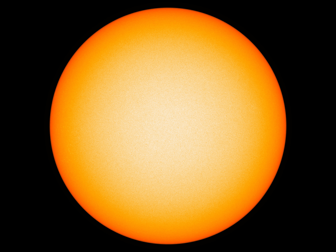 Яркое желтое солнце на черном фоне