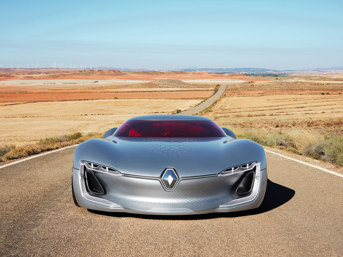 Стильный серебристый электромобиль  Renault Trezor на трассе 