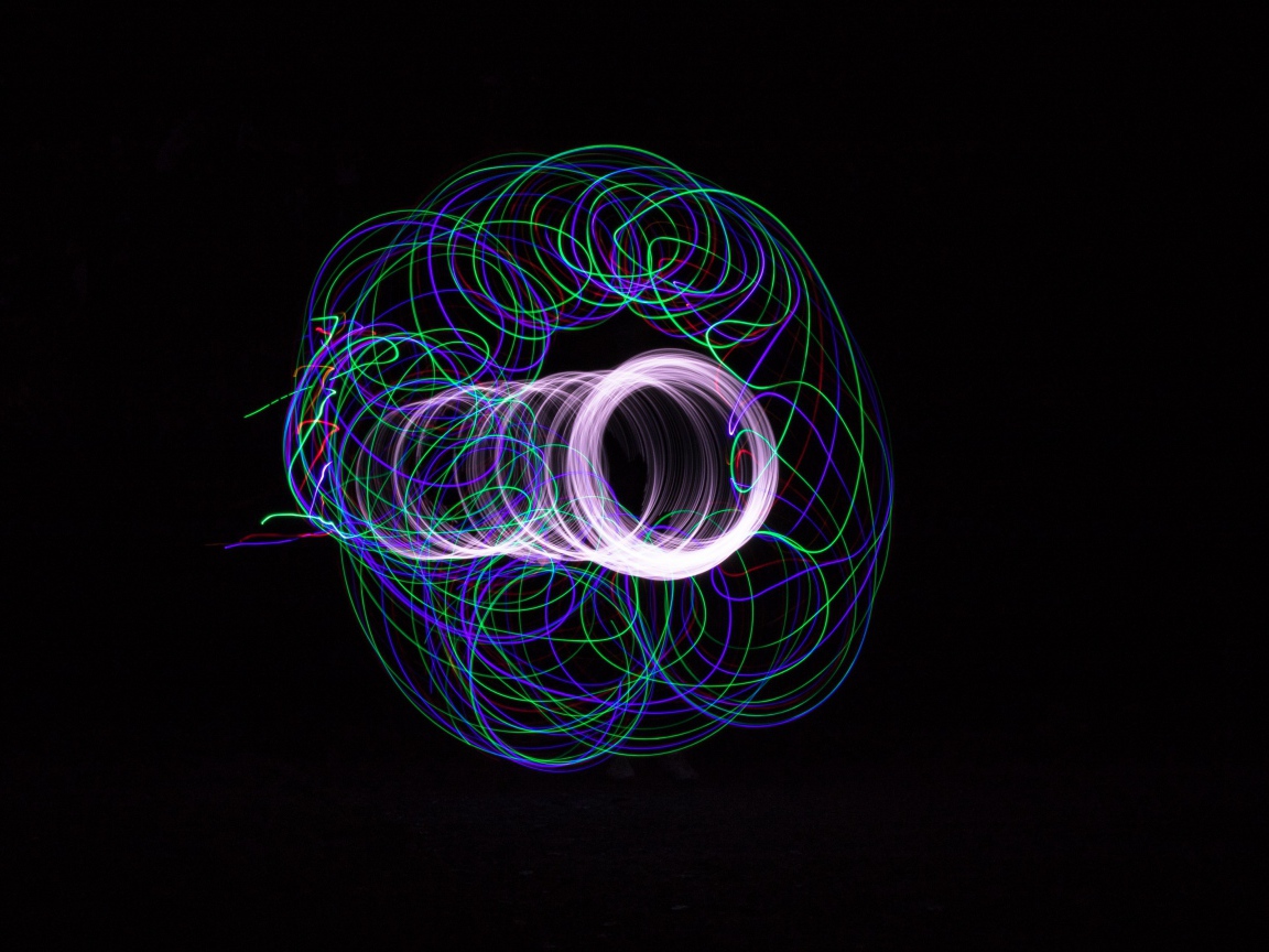 Multicolored neon circles on a black background