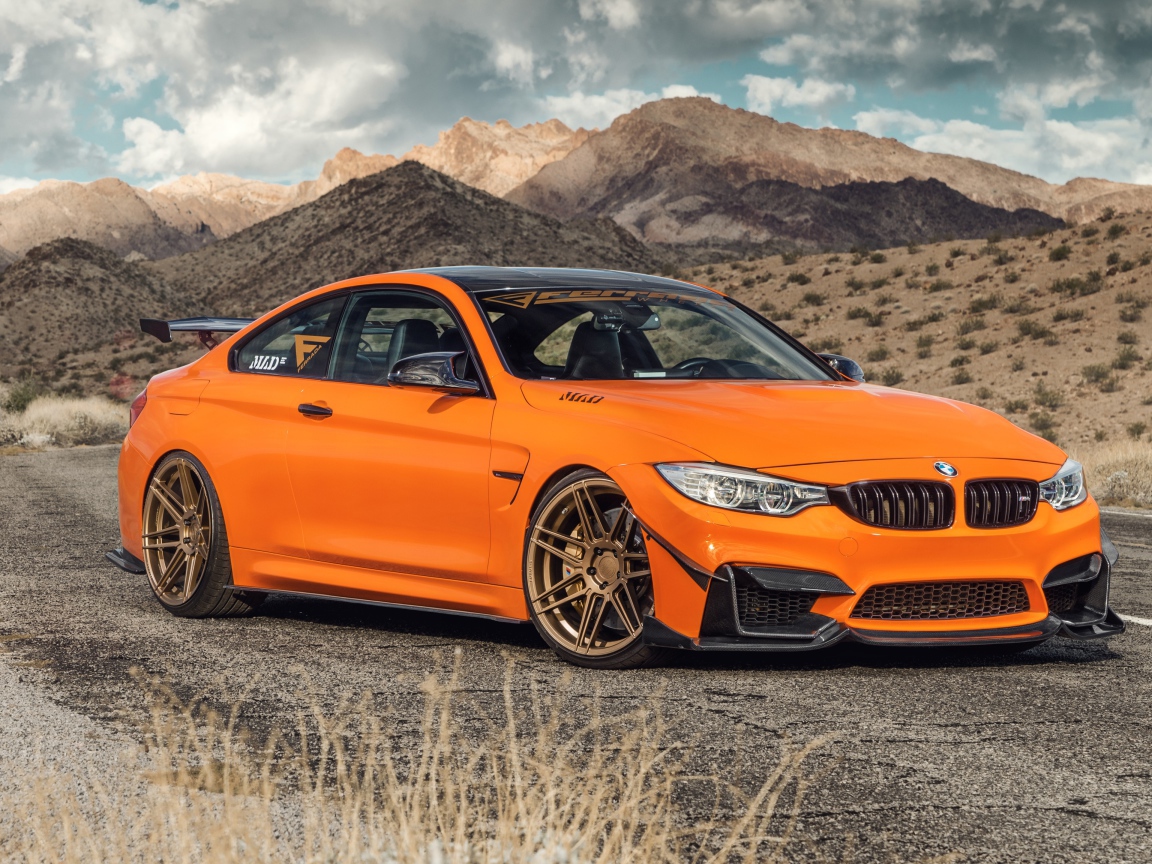 Новый автомобиль Ferrada Sema Orange BMW M4 на фоне гор