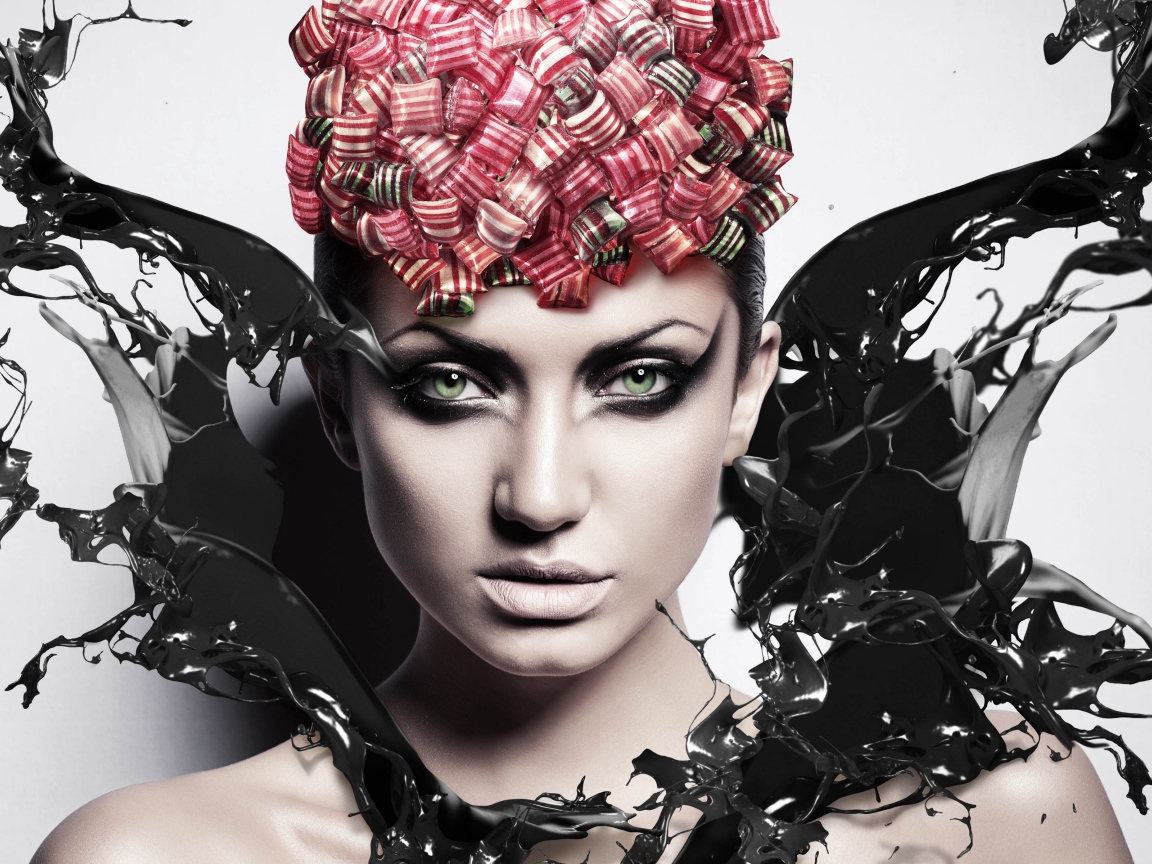 Красивая девушка с макияжем в брызгах черной краски