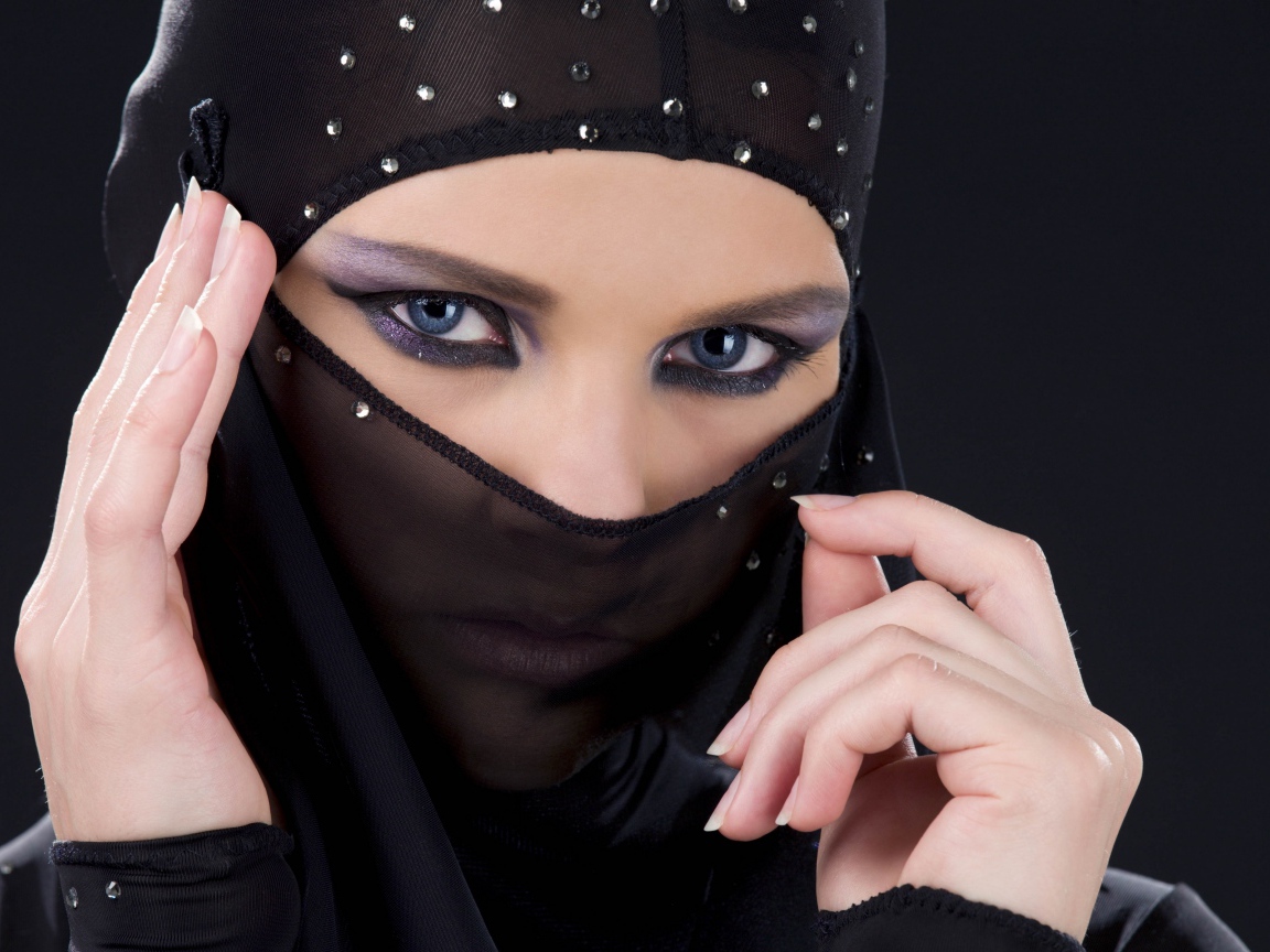 Beautiful oriental girl in a black veil
