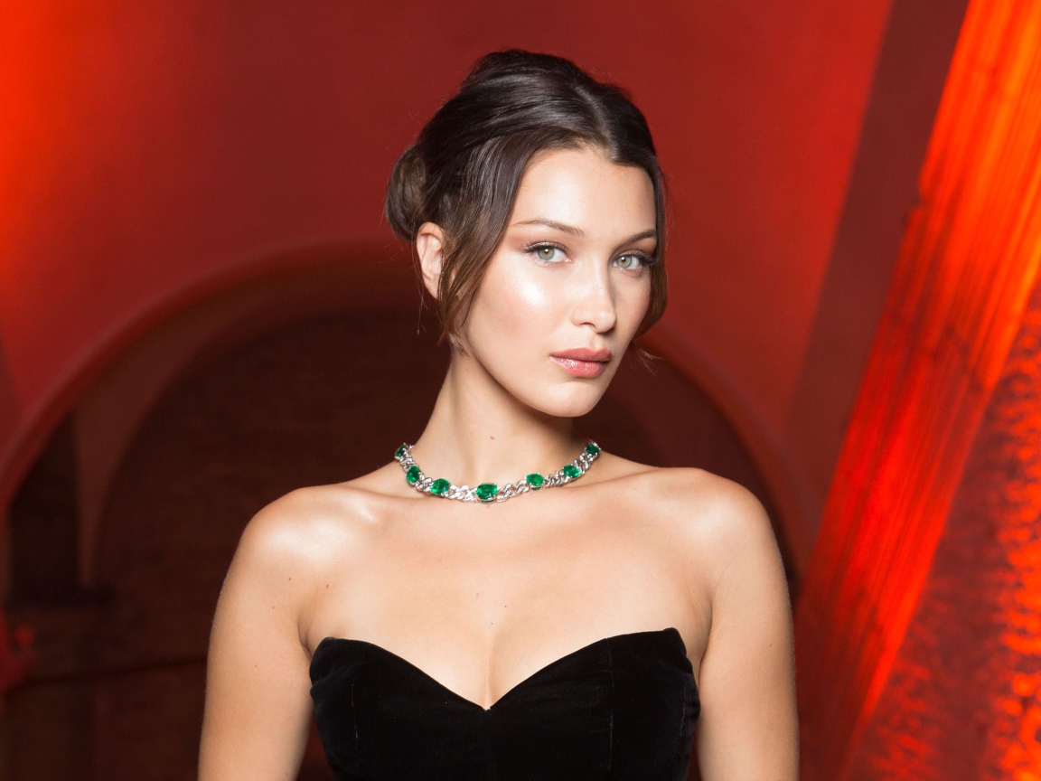 Stylish girl model Bella Hadid with decoration on the neck