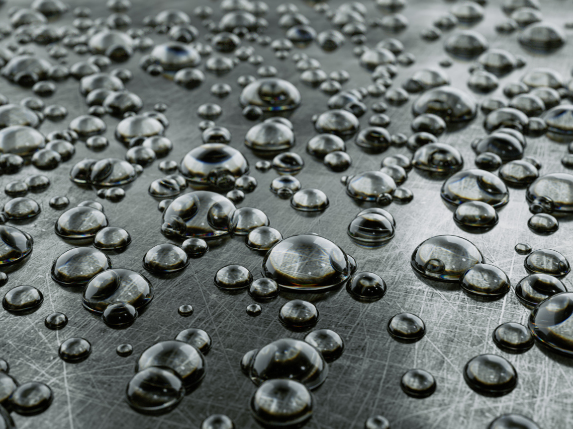 Много капель на серой железной поверхности 