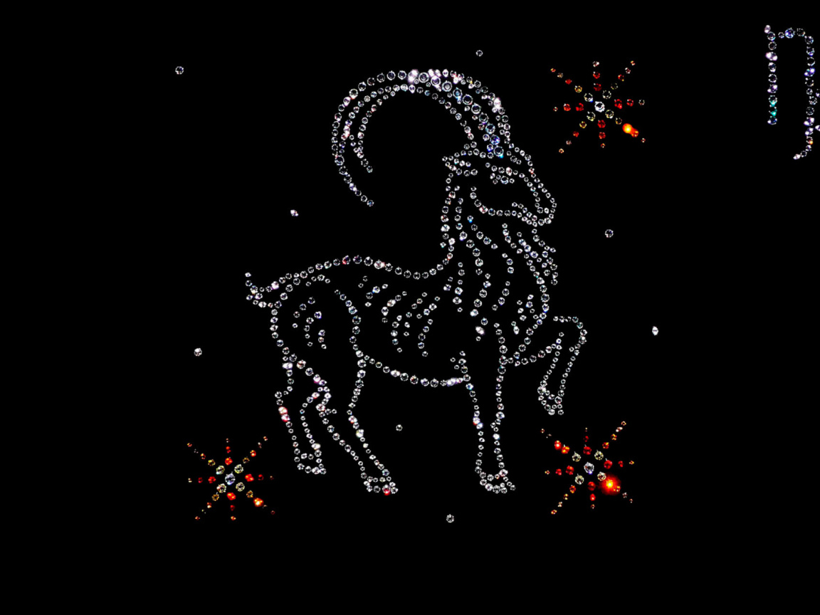 Блестящий знак зодиака козерог  на черном фоне