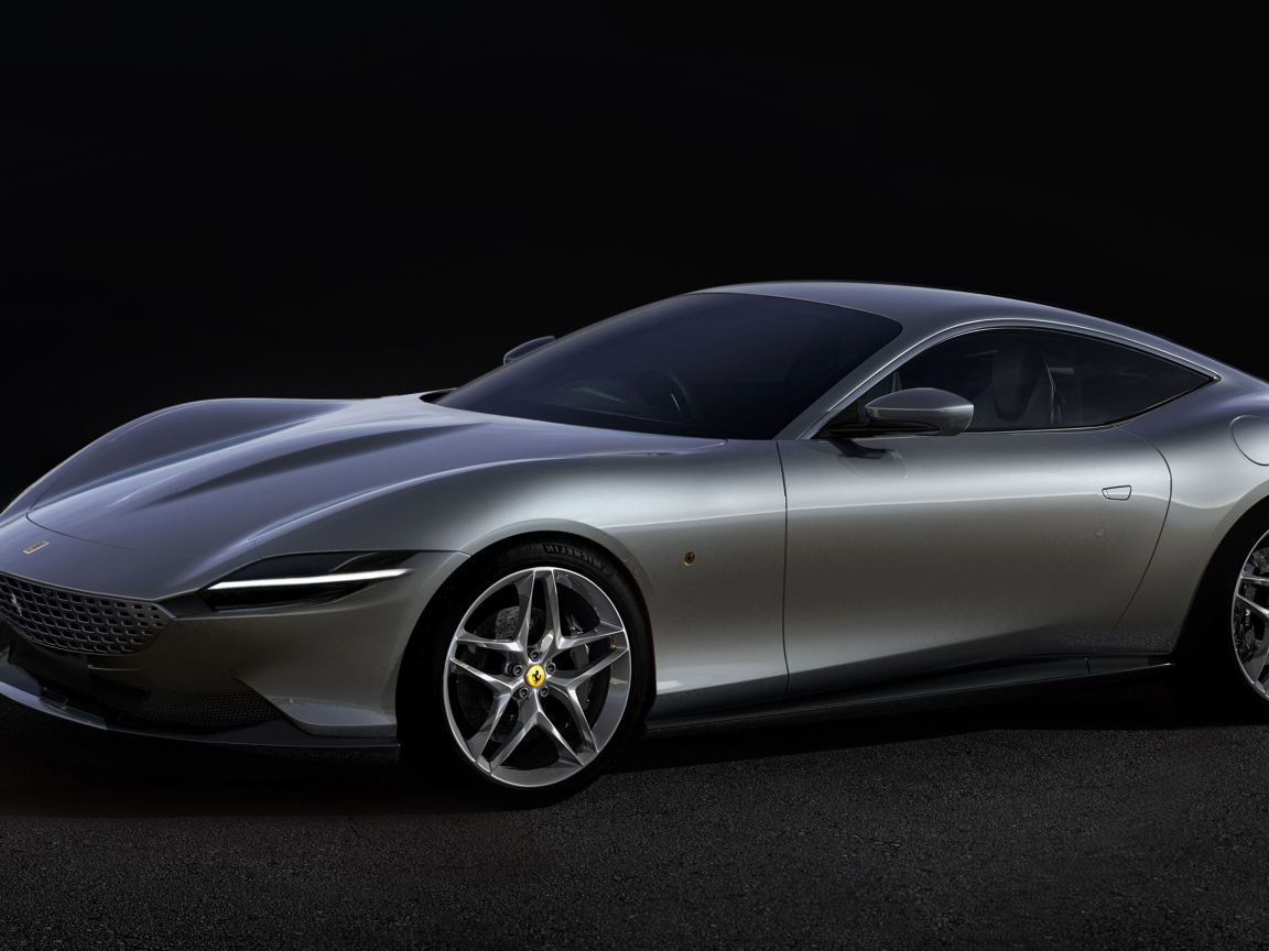 Серый автомобиль Aston Martin DBS Superleggera 2019 года на черном фоне