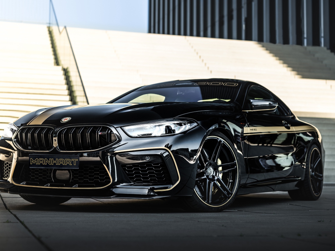 Черный автомобиль BMW Manhart MH8 800 2020 года у лестницы 