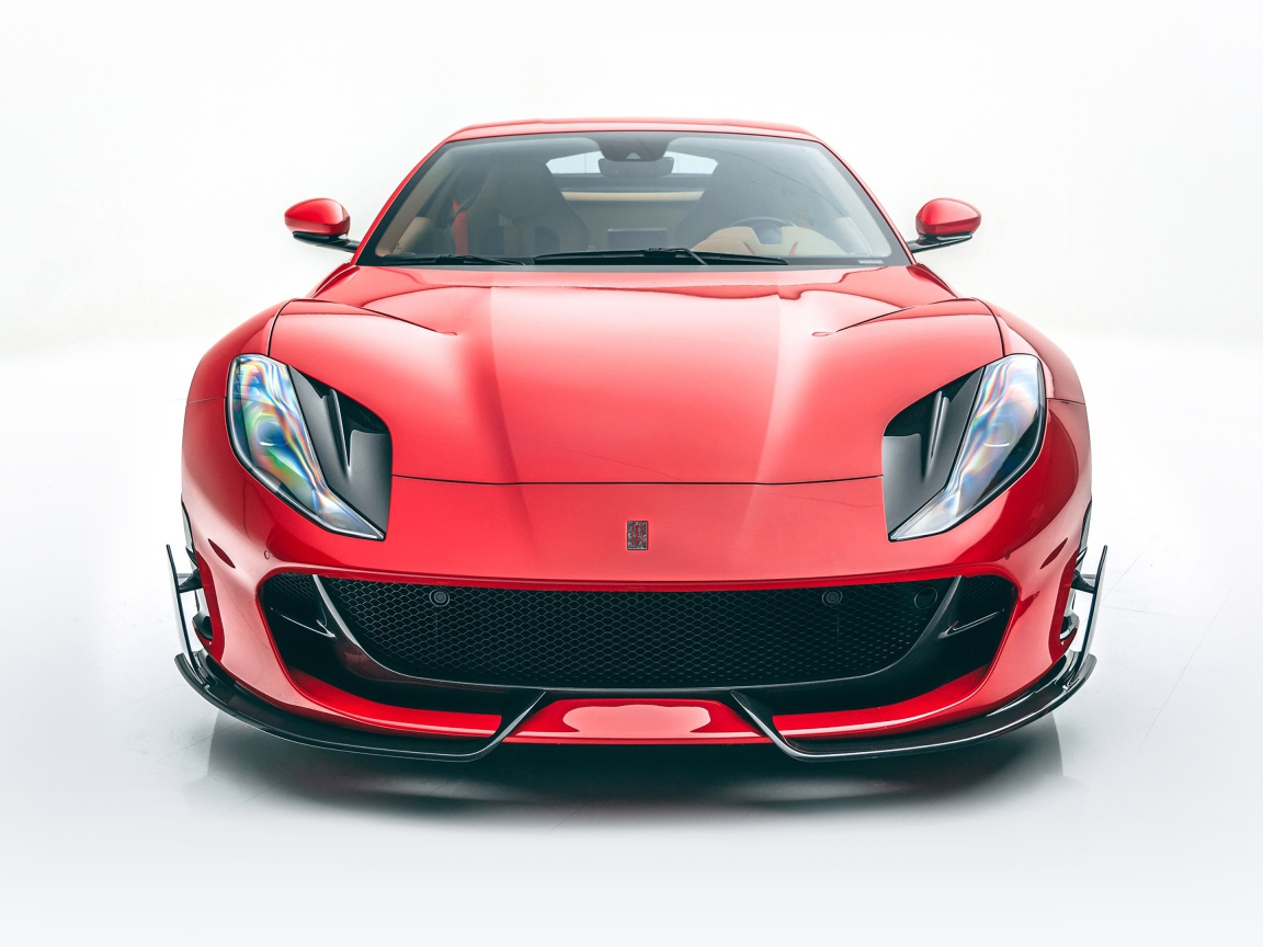 Красный автомобиль Mansory Ferrari 812,  2020 года на белом фоне