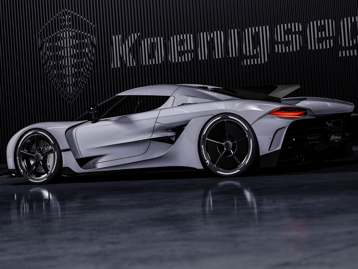 Автомобиль Koenigsegg Jesko Absolut 2020 года на фоне логотипа