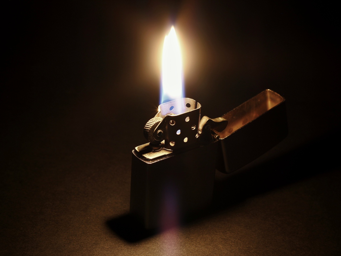Fire on a lit Zippo lighter