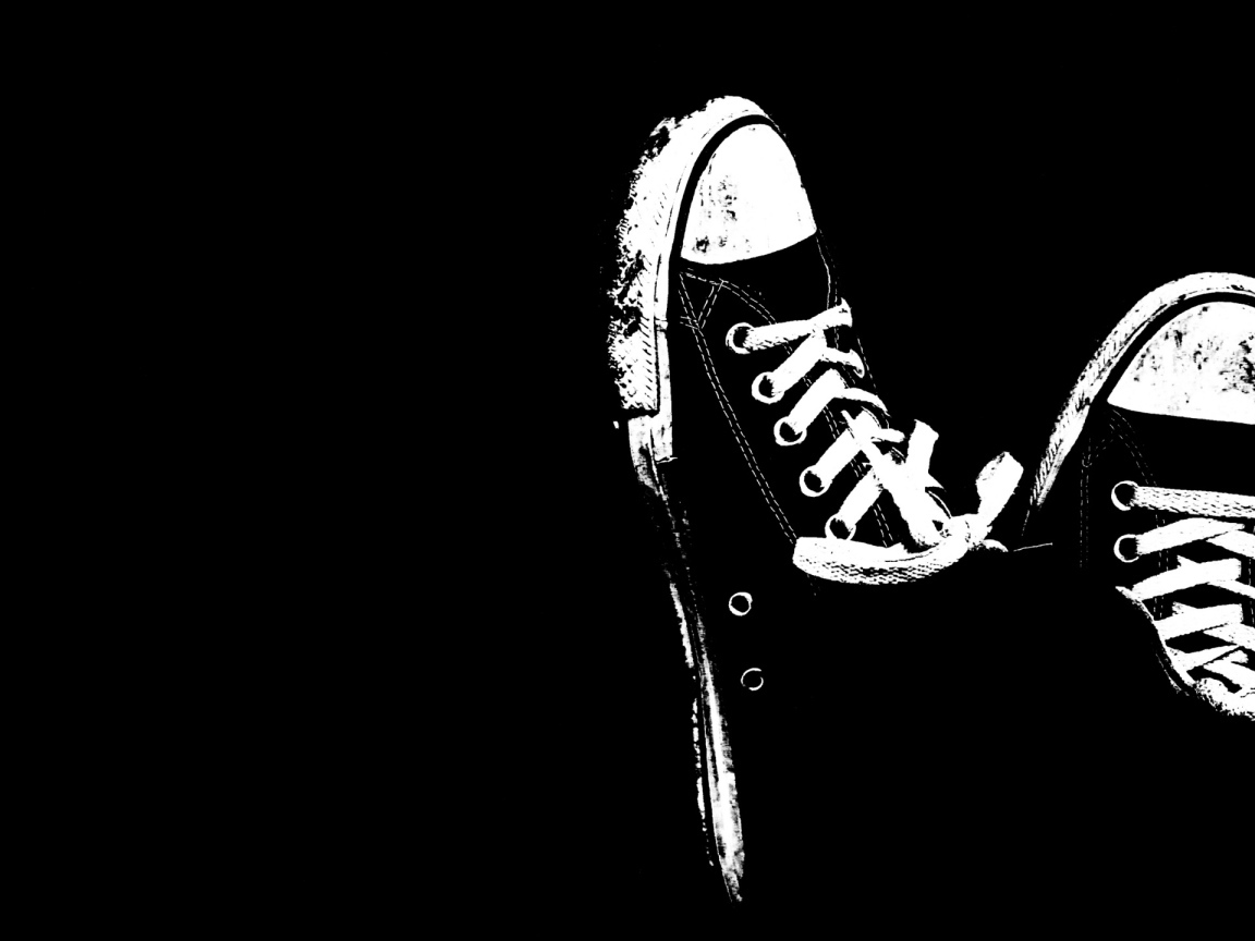 White sneakers on a black background