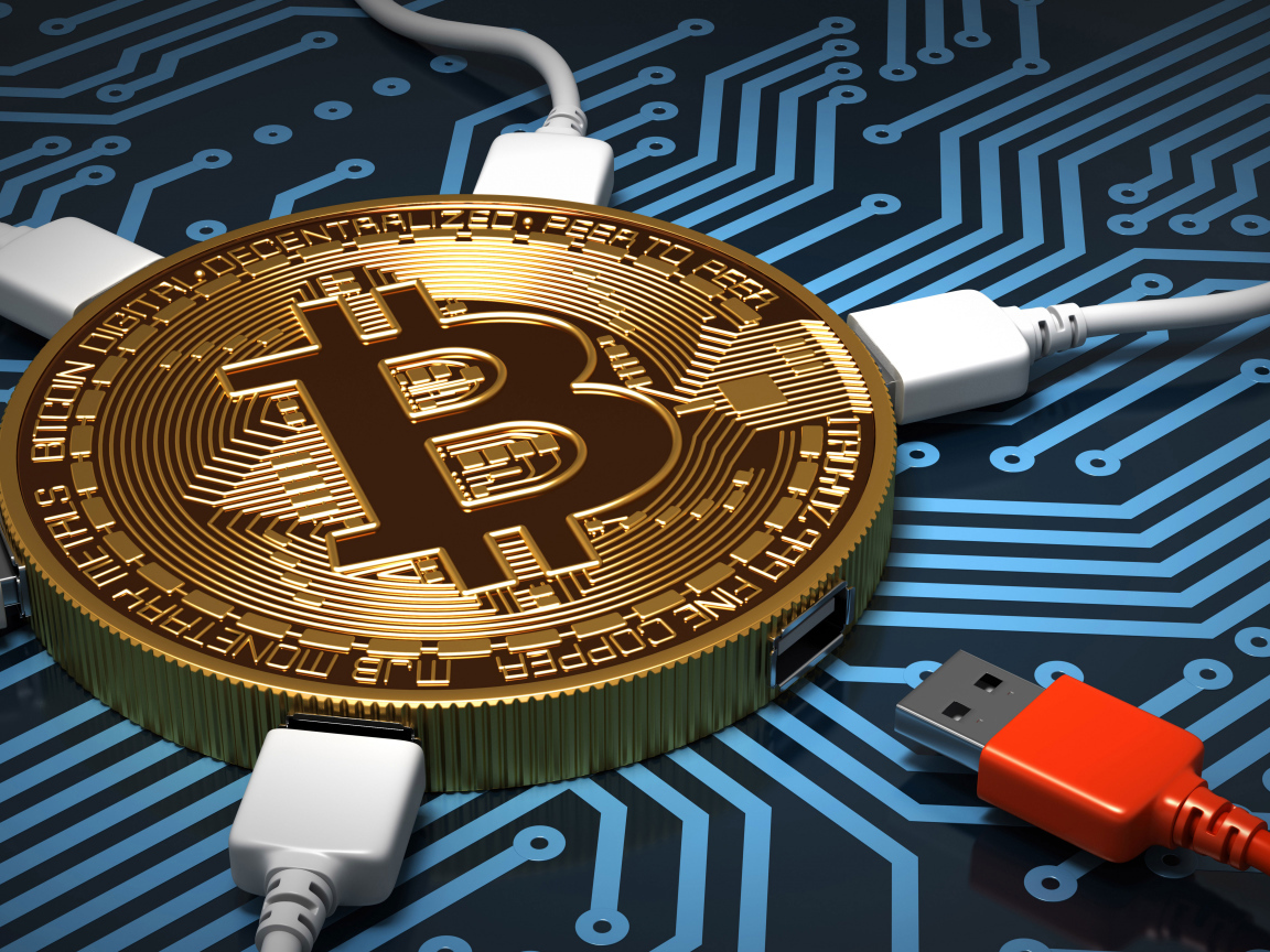 Кабель USB подключен к монете биткоин