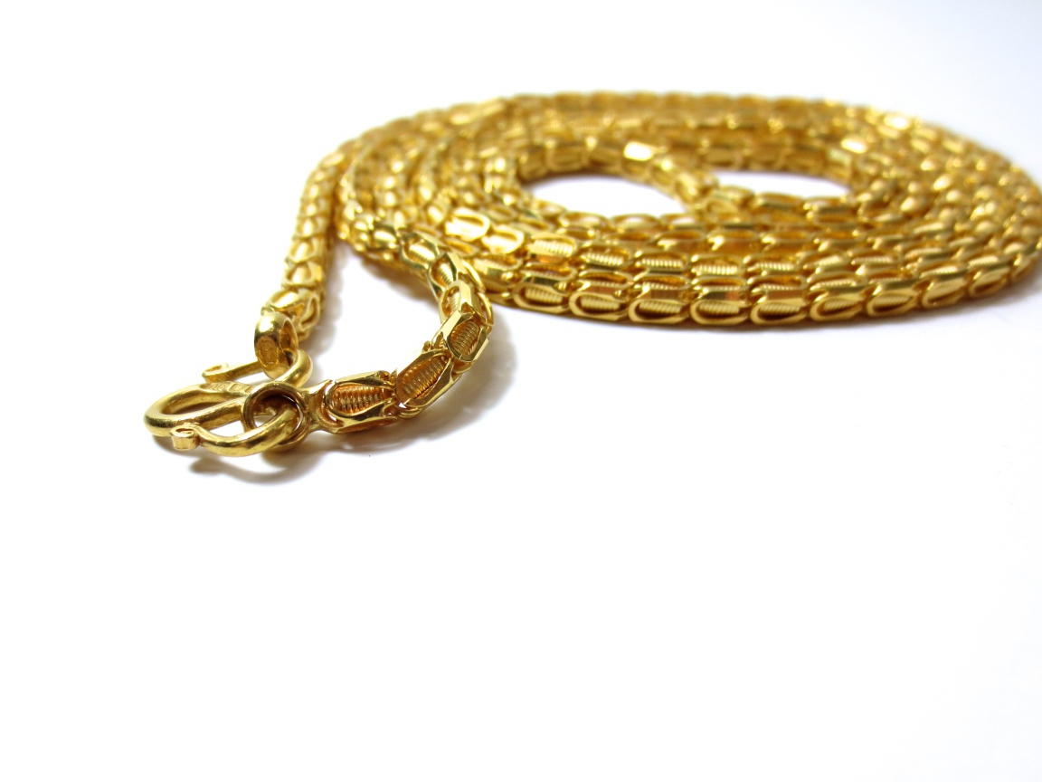 Big expensive gold chain on white background