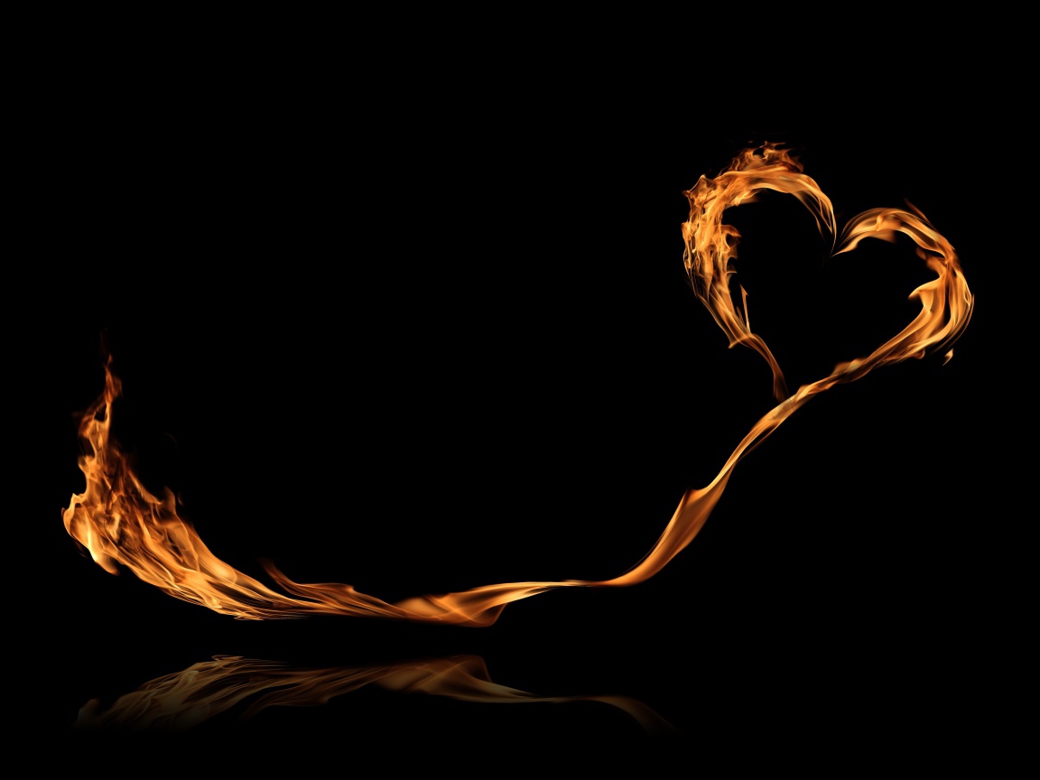 Bright fiery heart with a long tail on a black background