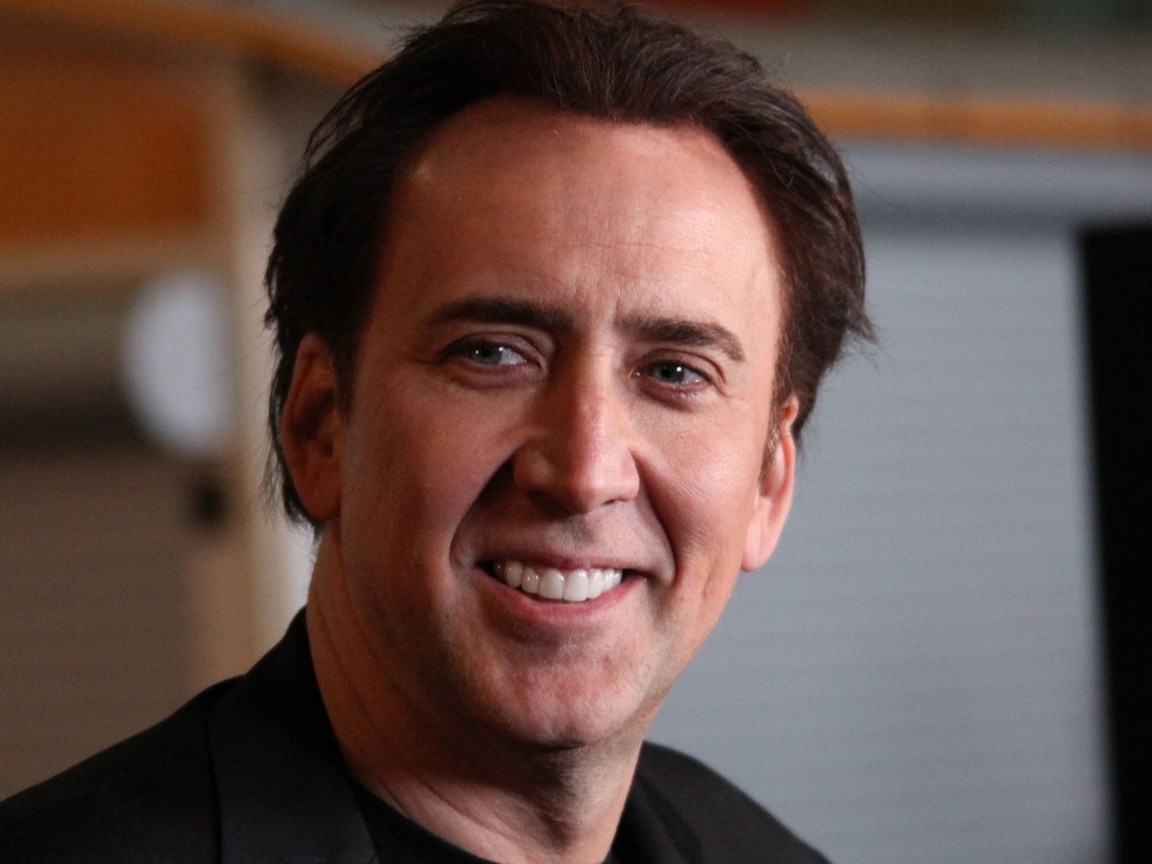 Улыбающийся мужчина,  актер Николас Кейдж