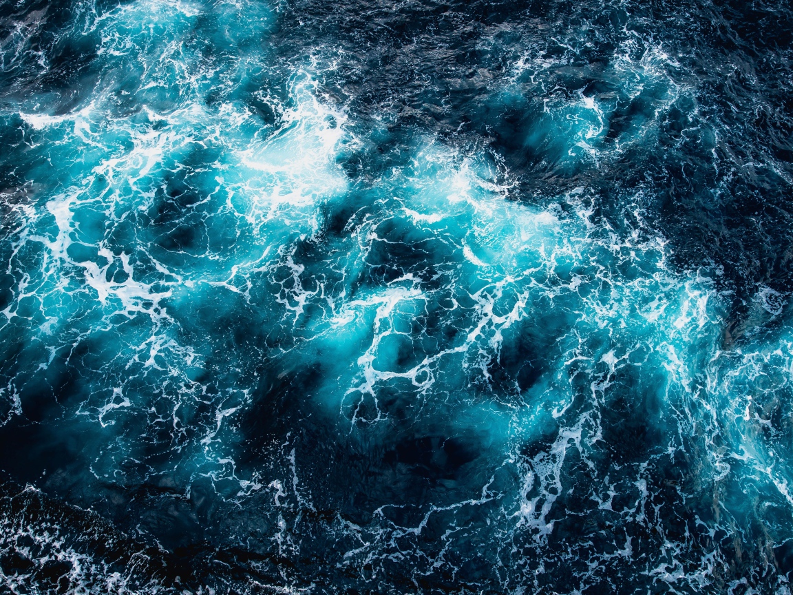 Top view of white waves in the ocean