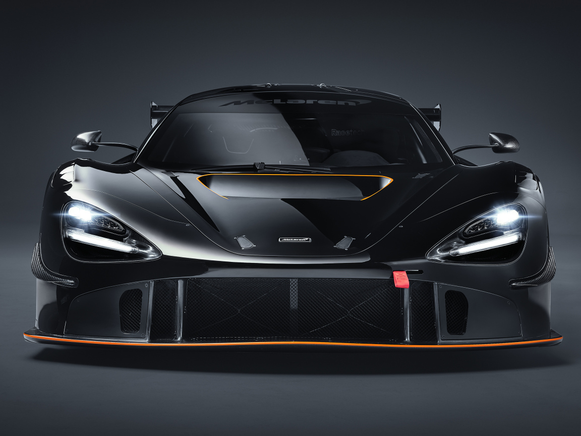 Автомобиль McLaren 720S GT3X 2021 года вид спереди на сером фоне