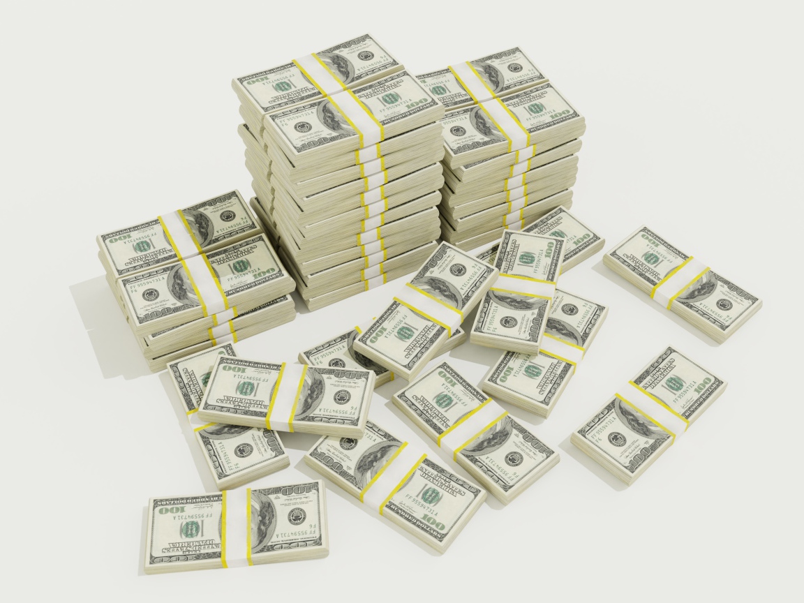 Пачки долларов на белом фоне