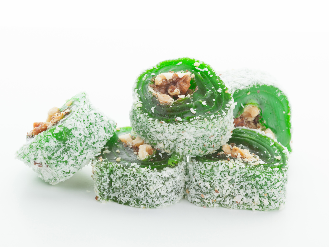 Green Turkish delight on a white background