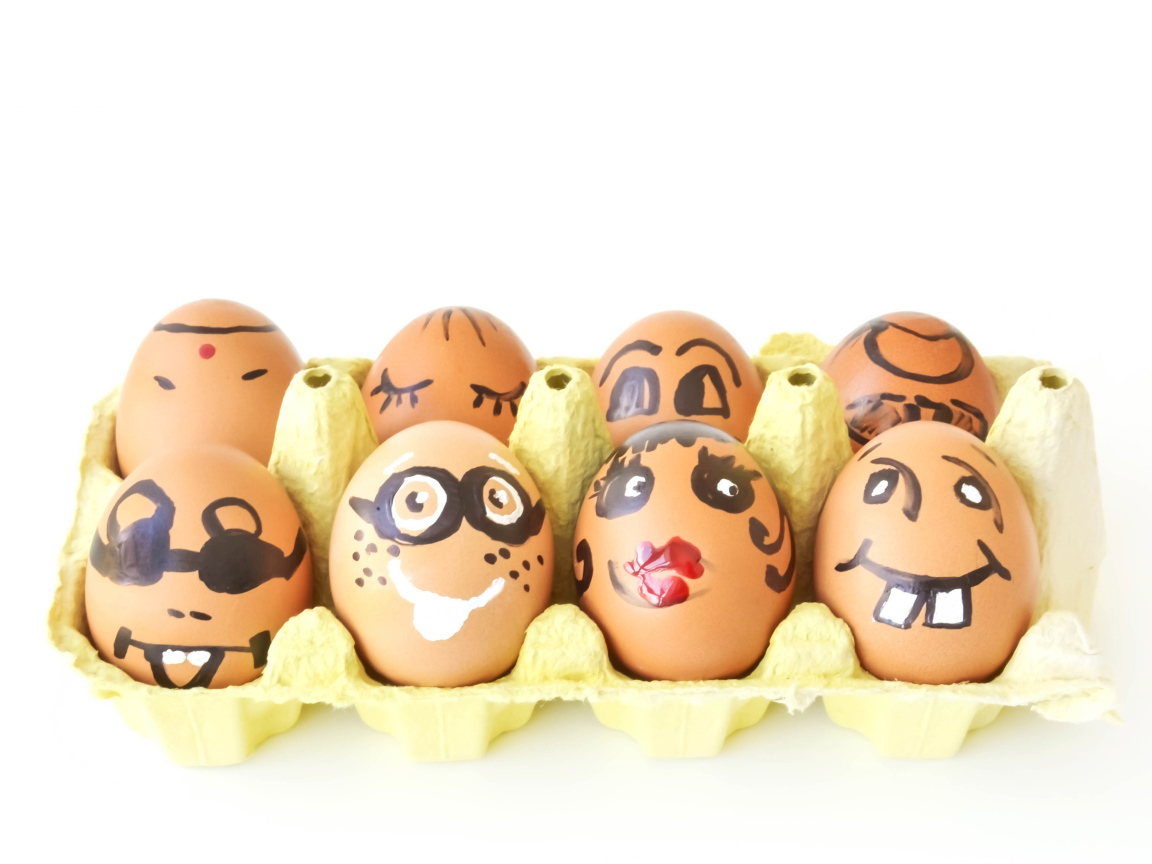 A dozen eggs with drawings on a white background