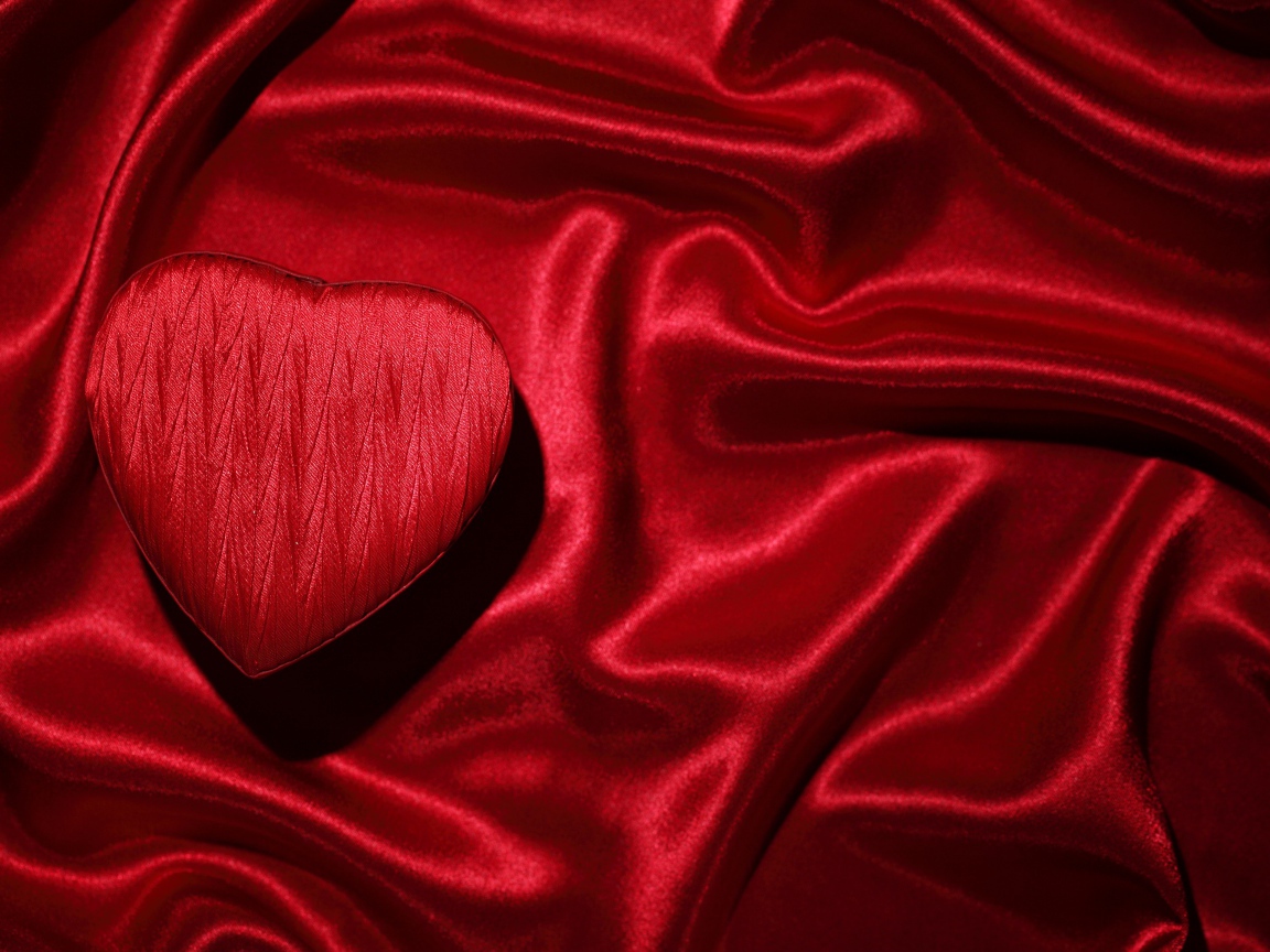 Red satin fabric and heart