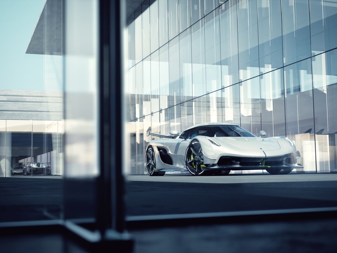 Автомобиль Koenigsegg Jesko у стеклянной стены