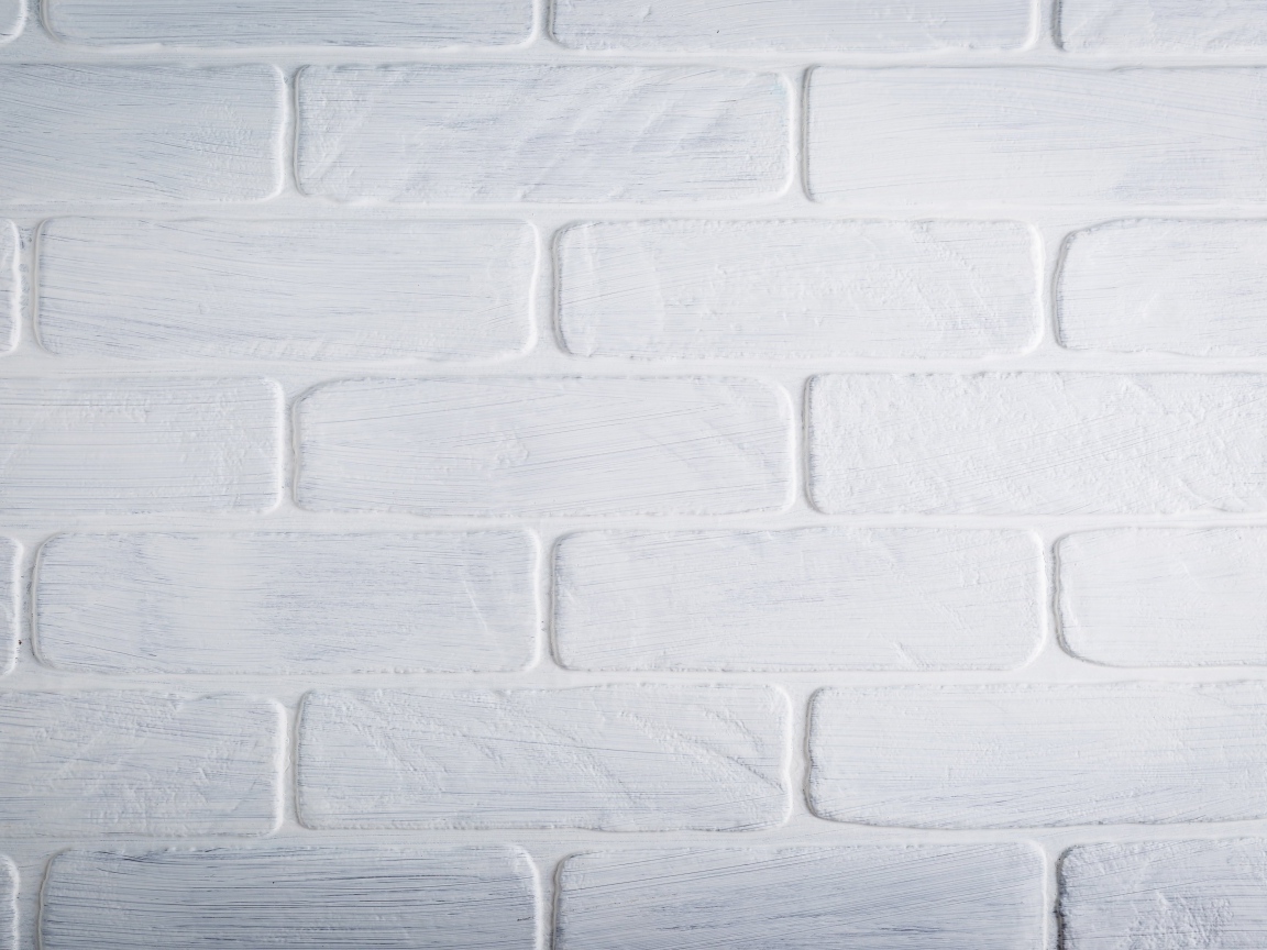 Белая кирпичная стена крупным планом