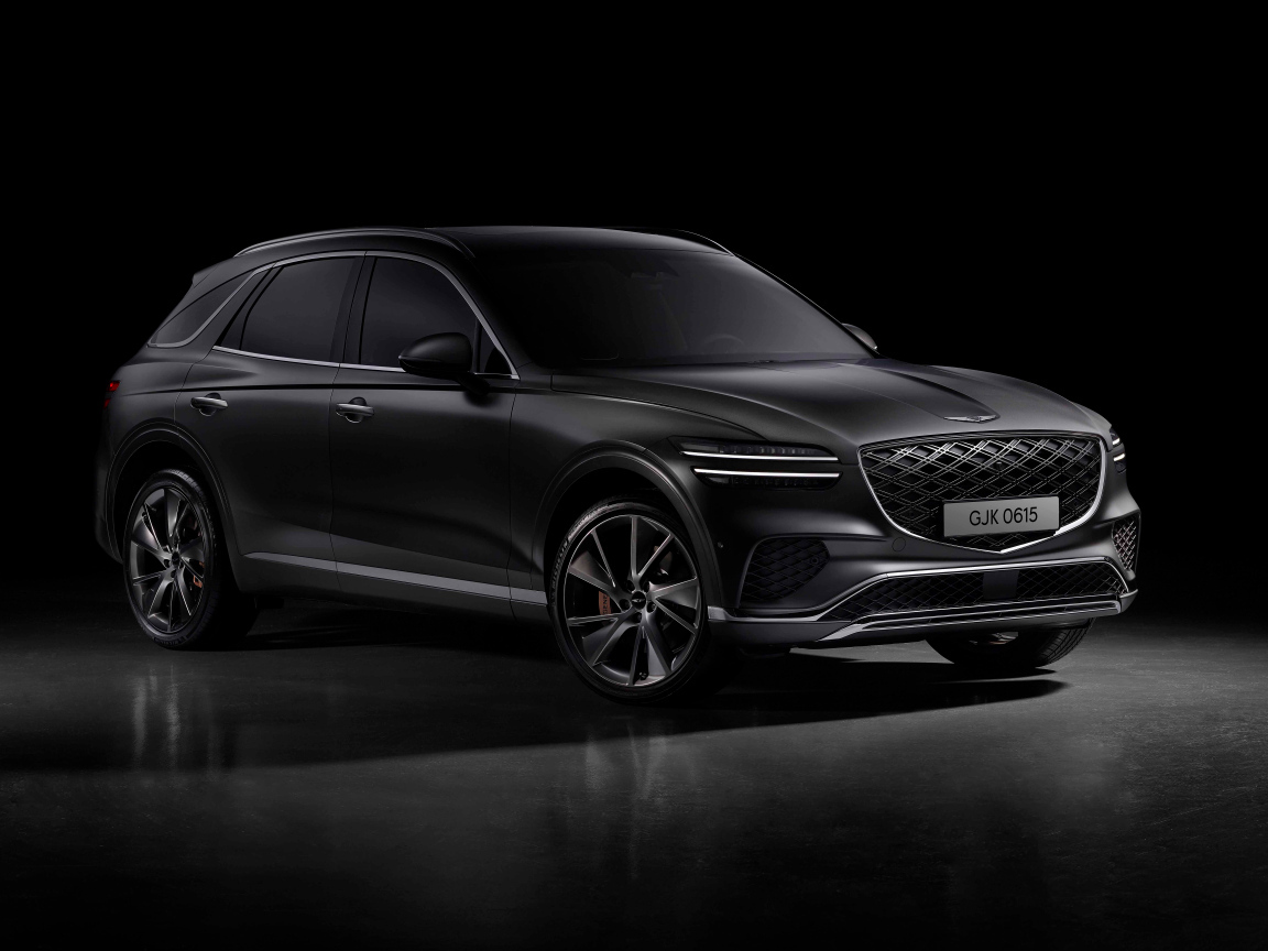 Автомобиль Genesis GV70 2024 года на черном фоне