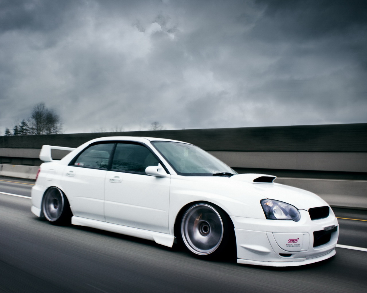 white Subaru Impreza STI