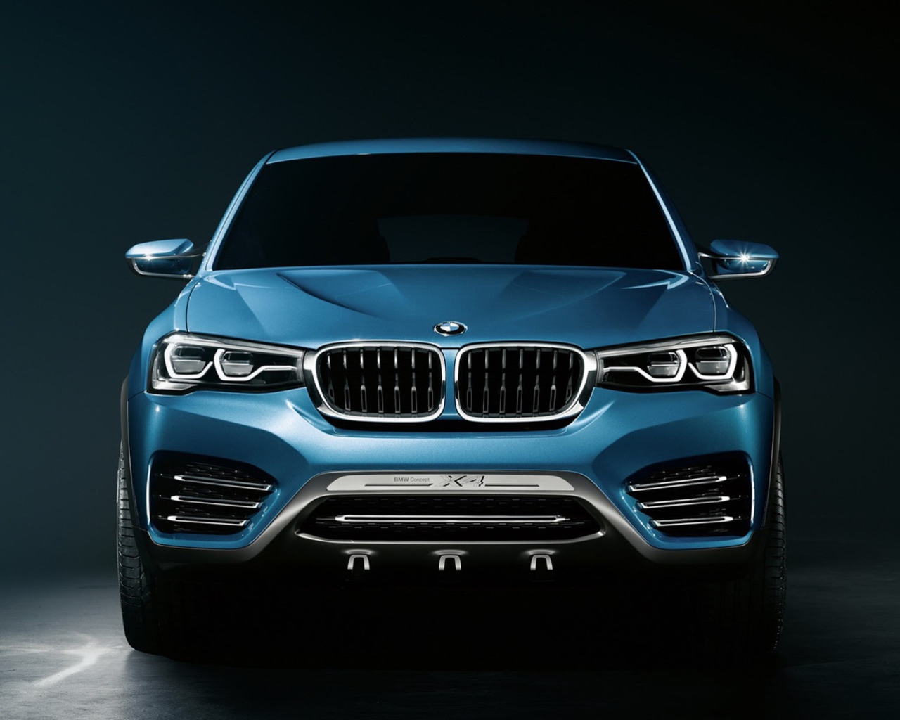 BMW X4 crossover on dark background