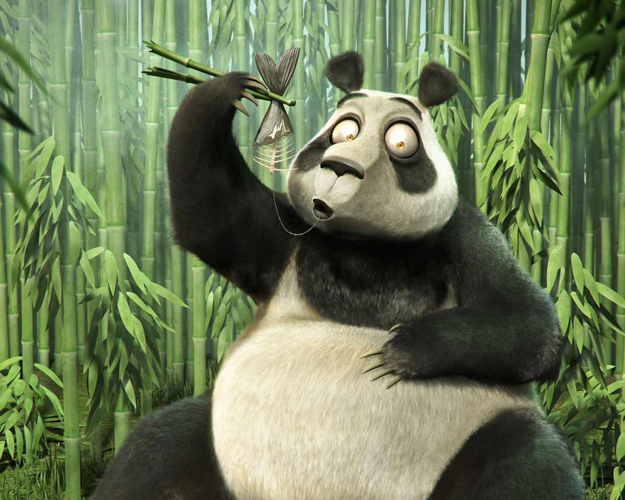 Панда палочками ест рыбу